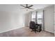 Bedroom featuring a desk and chair beneath a bright window and a ceiling fan at 201 Northview Dr, Middlesex, NC 27557