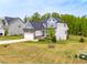 Exterior angle showing a two-story home with blue and gray siding and a large grassy yard at 201 Northview Dr, Middlesex, NC 27557