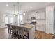 Bright, modern kitchen featuring granite countertops, stainless steel appliances, and a stylish island with seating at 201 Northview Dr, Middlesex, NC 27557