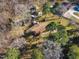 Aerial view of a single-Gathering home with a large yard, mature trees, and outbuildings at 217 Stephen Taylor Rd, Wake Forest, NC 27587
