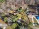 Overhead view of a residential property with a house, outbuildings, and surrounding trees at 217 Stephen Taylor Rd, Wake Forest, NC 27587