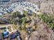 Expansive aerial view showing a mix of residential homes and undeveloped wooded areas at 217 Stephen Taylor Rd, Wake Forest, NC 27587