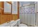 Bathroom features a sink, toilet and shower with patterned curtain at 217 Stephen Taylor Rd, Wake Forest, NC 27587