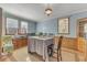 Bright dining room featuring a large window, vintage hutch, and a traditional table setting at 217 Stephen Taylor Rd, Wake Forest, NC 27587