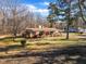 Charming brick ranch-style home with a cozy front porch and spacious front yard at 217 Stephen Taylor Rd, Wake Forest, NC 27587
