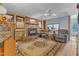 Comfortable living area features a brick fireplace, plush seating, and decorative area rug at 217 Stephen Taylor Rd, Wake Forest, NC 27587