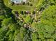 This home boasts an expansive and meticulously maintained yard, featuring gardens and lush greenery at 219 Colvard Park Dr, Durham, NC 27713