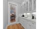 Chic bar area with glass-front cabinets and marble countertops, perfect for entertaining at 219 Colvard Park Dr, Durham, NC 27713