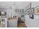 Stylish bar area with gray cabinetry, granite countertop, and comfortable seating at 219 Colvard Park Dr, Durham, NC 27713