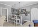 Stylish bar area with gray cabinetry, granite countertop, and comfortable seating at 219 Colvard Park Dr, Durham, NC 27713