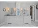 Bright bathroom with dual vanities, elegant lighting, and ample storage space at 219 Colvard Park Dr, Durham, NC 27713