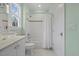 Clean bathroom features a shower/tub combo, a toilet, and a modern sink with green walls at 219 Colvard Park Dr, Durham, NC 27713