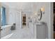 Elegant bathroom with a freestanding tub, dual vanities, and a view into the walk-in closet at 219 Colvard Park Dr, Durham, NC 27713
