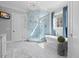 Bathroom with a luxurious soaking tub, glass-enclosed shower, and refined finishes at 219 Colvard Park Dr, Durham, NC 27713