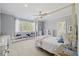 Serene bedroom with a canopy bed, window bench, and ample natural light for a cozy retreat at 219 Colvard Park Dr, Durham, NC 27713