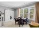 Cozy breakfast nook with large windows and a modern barn door entrance at 219 Colvard Park Dr, Durham, NC 27713