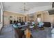Relaxing covered patio with seating area, outdoor kitchen, and expansive views of the property at 219 Colvard Park Dr, Durham, NC 27713
