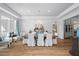 Elegant dining room bathed in light, featuring a decorative chandelier and neutral tones at 219 Colvard Park Dr, Durham, NC 27713