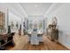 Formal dining room showcasing coffered ceilings, a modern chandelier, and wood floors at 219 Colvard Park Dr, Durham, NC 27713