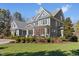Elegant home features a meticulously landscaped yard, offering an inviting curb appeal at 219 Colvard Park Dr, Durham, NC 27713