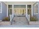 Inviting front porch with comfortable seating, perfect for relaxing and enjoying the outdoors at 219 Colvard Park Dr, Durham, NC 27713