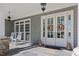 Inviting covered porch featuring classic rocking chairs and an elegant double door at 219 Colvard Park Dr, Durham, NC 27713