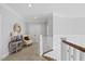 Upstairs hallway with beautiful trim, neutral colors, and access to other rooms in the home at 219 Colvard Park Dr, Durham, NC 27713