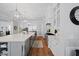 Beautiful kitchen featuring stainless appliances, eat-in breakfast bar, hardwood flooring, and custom cabinets at 219 Colvard Park Dr, Durham, NC 27713