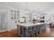Open gourmet kitchen with large center island, breakfast bar, stainless appliances, and stone countertops at 219 Colvard Park Dr, Durham, NC 27713