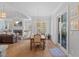 Open-concept living and dining space featuring a fireplace and seamless access to the outdoors at 219 Colvard Park Dr, Durham, NC 27713