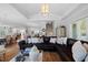 Spacious living room features a leather sofa, hardwood floors, and modern decor at 219 Colvard Park Dr, Durham, NC 27713