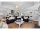 Spacious living area with high ceilings, a large leather sofa, and stylish decor elements at 219 Colvard Park Dr, Durham, NC 27713