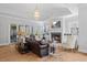 Cozy living room featuring a fireplace, plush seating, and large windows for natural light at 219 Colvard Park Dr, Durham, NC 27713