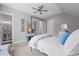 Serene main bedroom with a four-poster bed, ceiling fan, and ensuite bathroom at 219 Colvard Park Dr, Durham, NC 27713