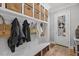 Mudroom features built-in storage, bench seating, coat hooks and access to the front door at 219 Colvard Park Dr, Durham, NC 27713