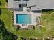 Aerial shot of the pool, hot tub, and deck area with meticulous landscaping and patio furniture at 219 Colvard Park Dr, Durham, NC 27713
