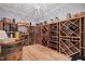 Stunning wine cellar features custom shelving and a temperature-controlled environment for proper wine storage at 219 Colvard Park Dr, Durham, NC 27713