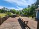Large weathered deck area with barbecue grill and bench at 22 Woodridge Ln, Cameron, NC 28326