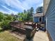 A blue home with a wooded deck area at 22 Woodridge Ln, Cameron, NC 28326