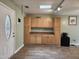 An eat-in kitchen with cabinets and a mini fridge at 22 Woodridge Ln, Cameron, NC 28326