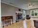 Comfortable living room boasts a stone fireplace and hardwood floors at 22 Woodridge Ln, Cameron, NC 28326