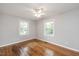 Comfortable bedroom with hardwood flooring and natural light at 2453 Derby Dr, Raleigh, NC 27610