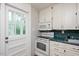 Functional kitchen features white cabinets, and a convenient microwave at 2453 Derby Dr, Raleigh, NC 27610