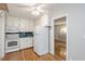 Efficient kitchen with white cabinetry and appliances at 2453 Derby Dr, Raleigh, NC 27610