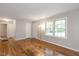 Inviting living area featuring bright windows and hardwood floors at 2453 Derby Dr, Raleigh, NC 27610