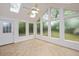 Bright sunroom boasts tile flooring and ample natural light at 2453 Derby Dr, Raleigh, NC 27610