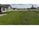 Expansive backyard features lush green grass, secured with a privacy fence, ready for outdoor activities and enjoyment at 30 Imperial Dr, Clayton, NC 27527