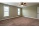 Inviting bedroom with neutral carpet, bright windows, and ample space for personalization at 30 Imperial Dr, Clayton, NC 27527