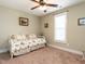 Neutral bedroom features a daybed with floral bedding and a ceiling fan at 30 Imperial Dr, Clayton, NC 27527