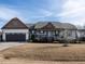 Charming single-story home with an attached two-car garage and covered front porch at 30 Imperial Dr, Clayton, NC 27527